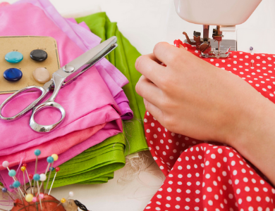 hands using a sewing machine
