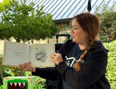 Woman reading a book aloud